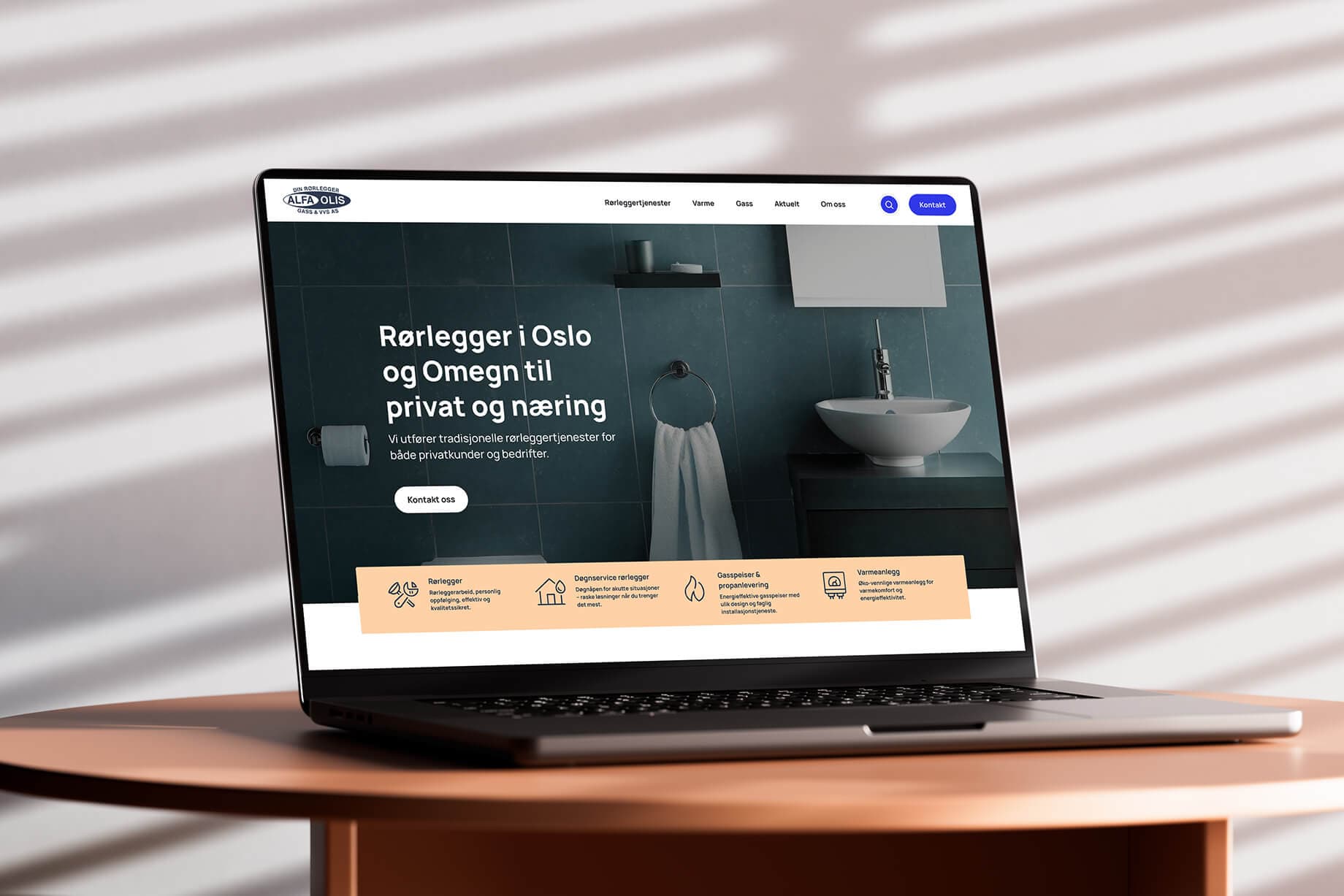Bilde av laptopen som viser forsiden til den nye websiden til Alfa Olis, utviklet av A2N 